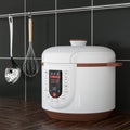 Modern Electric Multi Cooker in front of Black Tile Wall. 3d Rendering