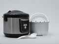 Modern electric multi cooker, parts and accessories Royalty Free Stock Photo