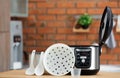 Modern electric multi cooker, parts and accessories Royalty Free Stock Photo
