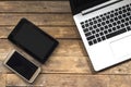 Modern electronic communication tools on a wooden floor