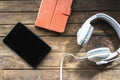 Modern electronic communication tools on a wooden floor