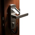 Modern electronic door lock system attached to a wooden door frame Royalty Free Stock Photo