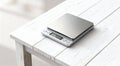 Modern electronic kitchen scale on white wooden table closeup Royalty Free Stock Photo