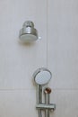 Modern elegant stainless steel shower head in a bathroom