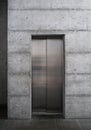 Modern elevator in a concrete building Royalty Free Stock Photo