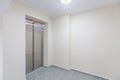 Modern elevator in residential building. Lobby interior with elevator door Royalty Free Stock Photo