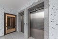 Modern elevators in a business lobby, hotel or store. Interior of modern building