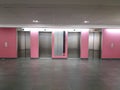 Elevators in pink walls