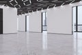 Modern empty concrete exhibition hall interior with windows and city view, many doors and mock up place on walls. Royalty Free Stock Photo