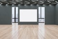 Modern empty concrete exhibition hall interior with wooden flooring, blank white poster, windows and city view, many doors and Royalty Free Stock Photo