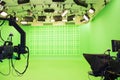 Modern empty green photo studio with modern style movie camera Royalty Free Stock Photo