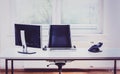 Modern empty office space desk with computer, phone and chair. Royalty Free Stock Photo