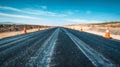 Modern Empty Road Under Construction with Traffic Cones on a Clear Day. Concept of Infrastructure Development Royalty Free Stock Photo