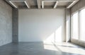 Modern empty room with concrete walls. Large windows let in bright sunlight casting geometric shadows on floor. Blank white wall Royalty Free Stock Photo