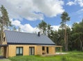 Modern energy saving house surrounded by green nature