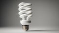 Modern energy-saving light bulb with spiral design against neutral background Royalty Free Stock Photo