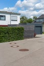 modern entrance area and garage in suburban street Royalty Free Stock Photo