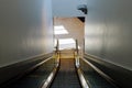 Modern escalator inside the international airport Royalty Free Stock Photo