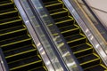 Modern escalator in shopping center. Escalator at an airport with no people. escalators in symmetry going up and down. Royalty Free Stock Photo