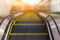 Modern escalator in shopping center. Escalator at an airport with no people. escalators in symmetry going up and down. Royalty Free Stock Photo