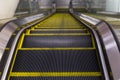 Modern escalator in shopping center. Escalator at an airport with no people. escalators in symmetry going up and down. Royalty Free Stock Photo