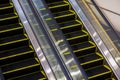 Modern escalator in shopping center. Escalator at an airport with no people. escalators in symmetry going up and down. Royalty Free Stock Photo