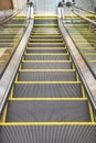 Moving down escalator in the community mall