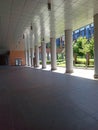 Modern example of architecture with an arcade full of columns in Perspective in Bologna Italy