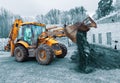 The modern excavator performs excavation work on the construction site. Front view of a digger bucket of digging ground Royalty Free Stock Photo