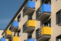 Modern facade building with yellow and blue balconies Royalty Free Stock Photo