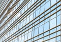 Modern facade of glass and steel with open window reflecting sky Royalty Free Stock Photo