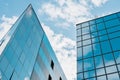 modern facade of glass and steel with reflections. Abstract or graphic photo of the sky with clouds seeming to continue Royalty Free Stock Photo