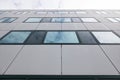 Modern facade of office buildings and reflections of clouds in w Royalty Free Stock Photo