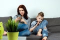 Modern family, everyone is sitting in smartphones than the passionate. The concept of harmfulness of modern gadgets, the