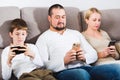 Modern family with smartphones at home Royalty Free Stock Photo