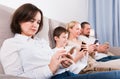 Modern family with smartphones at home Royalty Free Stock Photo