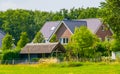 Modern farm house with a big grass pasture, Dutch architecture at the country side, Bergen op zoom, The Netherlands Royalty Free Stock Photo