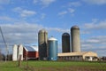 Farm with silos and grain driers Royalty Free Stock Photo