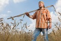 Modern farmer with scythe