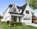 A modern farmhouse home with a white and brick exterior.