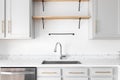 A modern farmhouse kitchen sink detail shot.