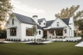 modern farmhouse with wrap-around porch and natural landscaping