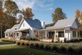 modern farmhouse with wrap-around porch and natural landscaping