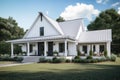 modern farmhouse, with wrap-around porch and swing, overlooking peaceful country landscape Royalty Free Stock Photo