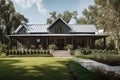 modern farmhouse with wraparound porch, wooden siding and metal accents against a lush green landscape