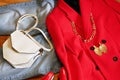 Modern fashion woman outfit with red jacket and blue jeans, bag, shoes and jewerly Royalty Free Stock Photo