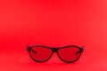 Modern fashionable and office spectacles isolated on red background Royalty Free Stock Photo