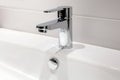 Modern chrome faucet in bathroom Royalty Free Stock Photo