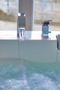 Modern faucet on the hot tub Royalty Free Stock Photo