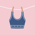 Modern female bra dried on a rope. Cute blue sport top after washing. Trendy undergarments. Vintage vector illustration Royalty Free Stock Photo